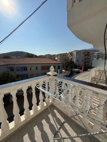 a glass railing on the balcony of a building at Vironas Hotel in Himare