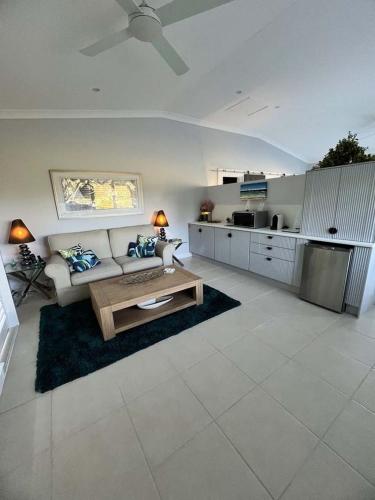 a living room with a couch and a table at The Country House at Hunchy Montville in Montville