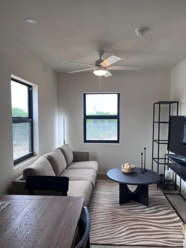 a living room with a couch and a table at Sea garden in Old Bight