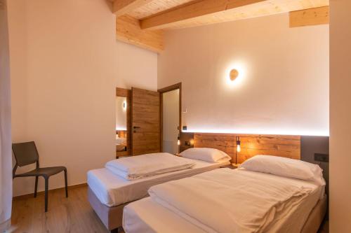 Una cama o camas en una habitación de Alpinia