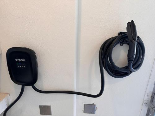 a black phone hanging on a wall at Ultimate Winery Getaway With Spa And Amazing Hilltop View in Temecula