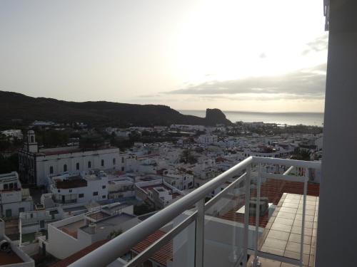 a view of a city from the balcony of a building at Alojamientos Harizan in Agaete
