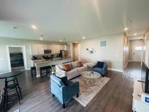 a living room with a couch and chairs and a table at Spacious Wyoming MI Getaway- Minutes to GR in Wyoming