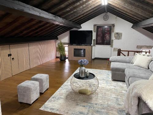 a living room with a couch and a table at Ocean View - Nordeste in Feteira Grande