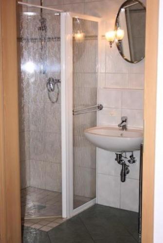 a bathroom with a shower and a sink at Fewo Wellenblick Trassenheide Usedom in Trassenheide