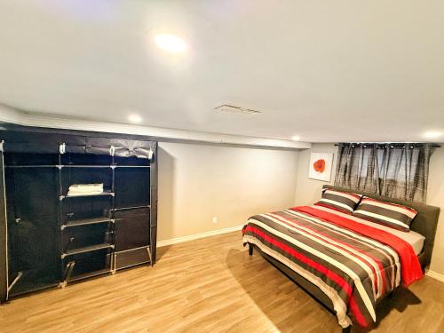 a bedroom with a bed and a closet at Modern Riverside 3BR, 2 Lounges, Office, by Casino in Windsor