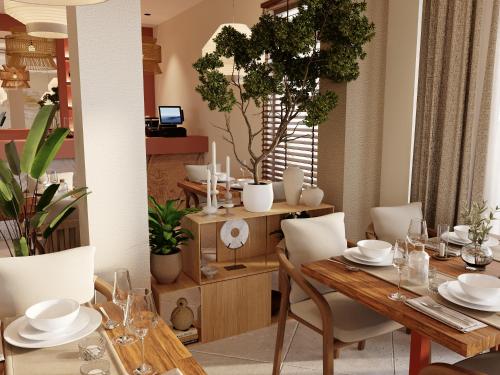 a dining room with a wooden table and chairs at Adiya Signature Hotel - Adults only in Kotor