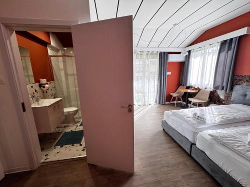 a room with a bedroom with a bed and a bathroom at Modern Studio Nr 10 private Kitchenette and Bathroom in Limassol