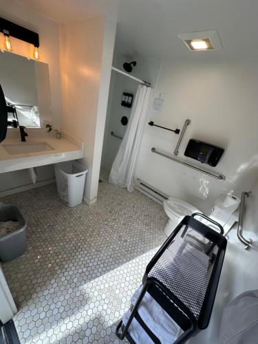 a bathroom with a walk in shower and a toilet at Riverside Colorado in Bellvue