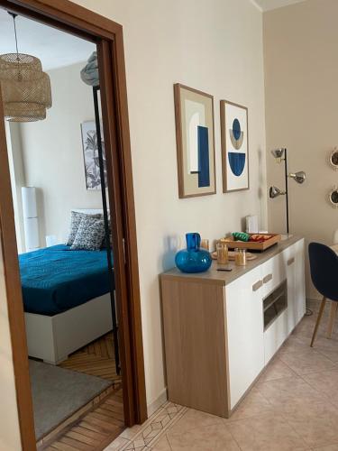 a room with a bedroom with a bed and a desk at Robert HoME Deluxe Apartment Turin in Turin