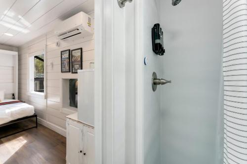 a bedroom with a door and a bed in a room at Riverside Colorado in Bellvue