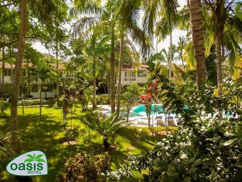 a resort with a swimming pool and palm trees at KERY-OASIS 2bdr with pool close to the Beach in Las Terrenas