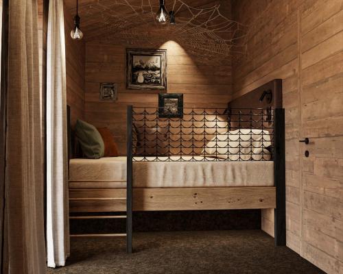 a bedroom with a bed in a wooden room at EdeR FriDa - Tuttiii KomPletti ALL inKlusiv in Maria Alm am Steinernen Meer