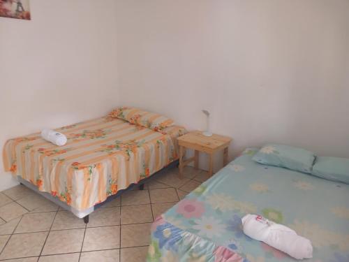 Postel nebo postele na pokoji v ubytování Posada colonial