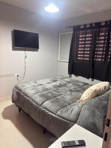 En eller flere senge i et værelse på Departamento ANDES