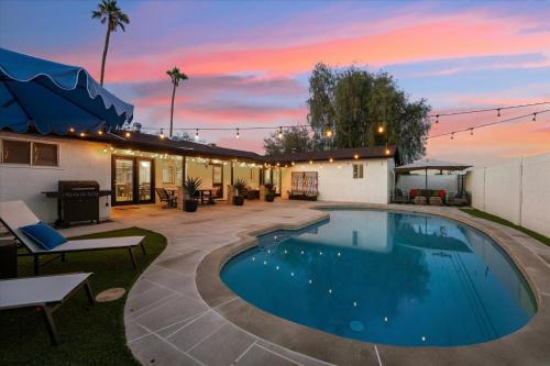 a swimming pool in the backyard of a house at Cactus Bloom Villa - Spacious 5BR near Old Town Scottsdale with Private Pool in Scottsdale