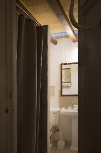 a bathroom with a sink and a mirror at Casa Aranci in Marsala