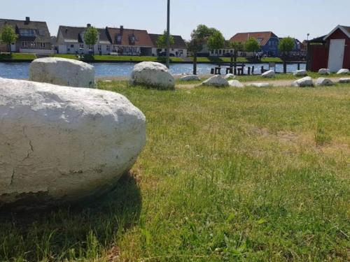 a group of large rocks in a grassy field at 4 person holiday home in Karrebæksminde-By Traum in Karrebæksminde
