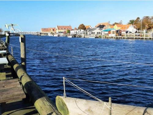 a boat is docked on a large body of water at 4 person holiday home in Karrebæksminde-By Traum in Karrebæksminde