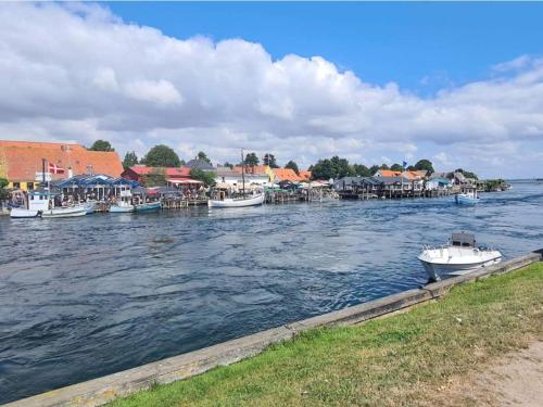 a group of boats are docked on a river at 4 person holiday home in Karrebæksminde-By Traum in Karrebæksminde