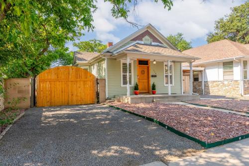 a house with a wooden gate and a driveway at Chic and Cozy Stay in Pueblo in Pueblo