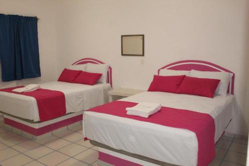 Postel nebo postele na pokoji v ubytování Hotel Real Da Vinci