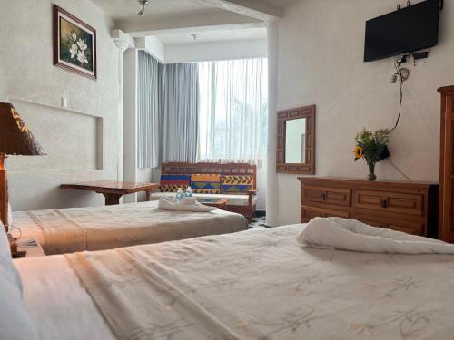 Cama o camas de una habitación en Hotel Fiesta Palmar