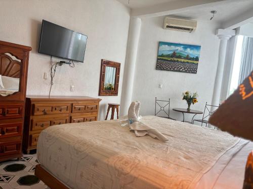 Cama o camas de una habitación en Hotel Fiesta Palmar