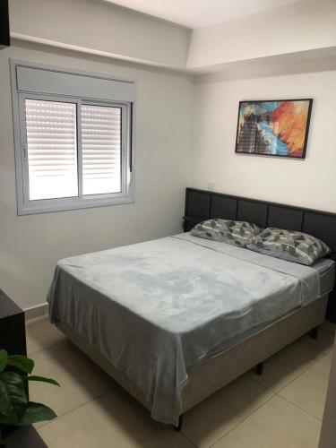 Ένα ή περισσότερα κρεβάτια σε δωμάτιο στο APOGEO - Apartamento Studio