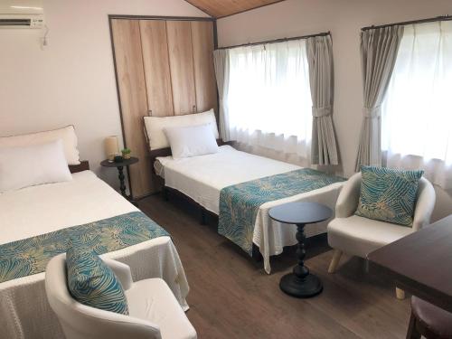 Cama ou camas em um quarto em 古民家の宿「こはる」