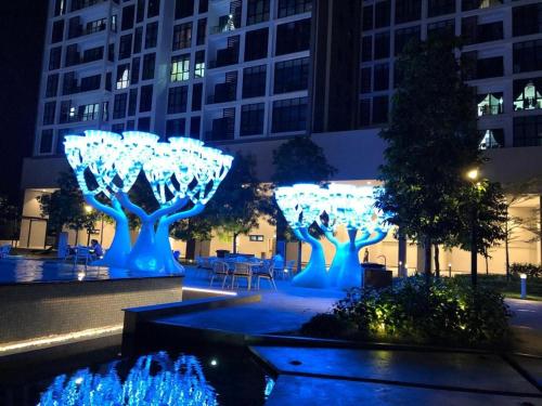 a group of trees with lights in a city at night at 28 Boulevard - Pandan Perdana Cheras KL in Kuala Lumpur
