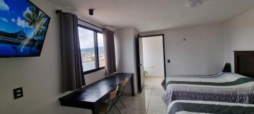 Postel nebo postele na pokoji v ubytování Hotel El Eden 4 per 15