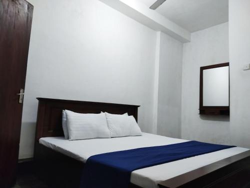 Ένα ή περισσότερα κρεβάτια σε δωμάτιο στο Green Holiday Inn