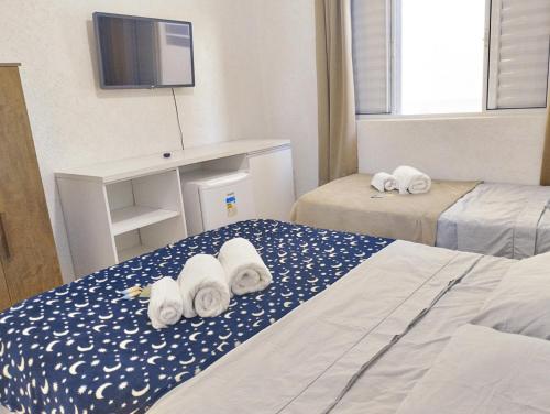 Ένα ή περισσότερα κρεβάτια σε δωμάτιο στο Casa DaLua Suítes