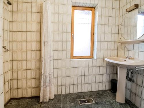a bathroom with a sink and a shower at Quiet valley view retreat in Roy