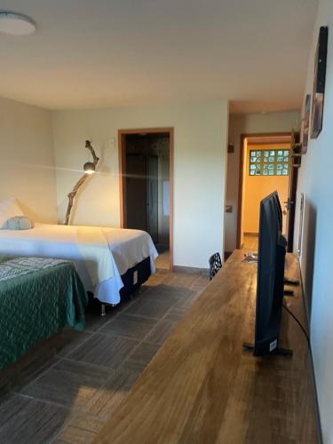 Postel nebo postele na pokoji v ubytování Hotel Sinhá