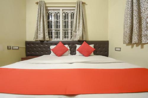 Postel nebo postele na pokoji v ubytování Hotel O RS Guest House