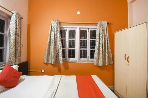 Postel nebo postele na pokoji v ubytování Hotel O RS Guest House