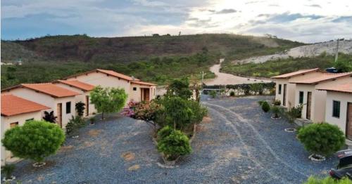 arial view of a village with houses and a road at Pousada Mont Hebrom in Ibicoara