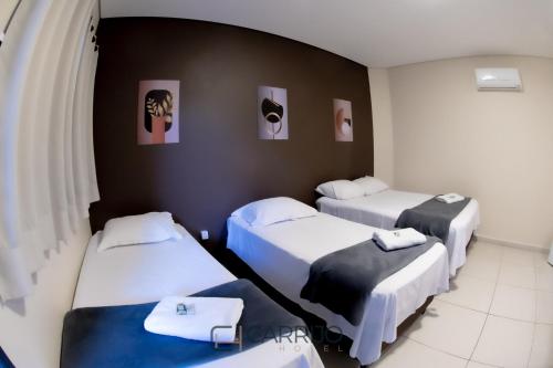 Katil atau katil-katil dalam bilik di Carrijo Hotel