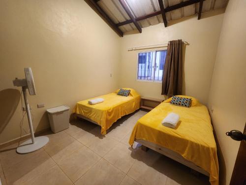En eller flere senge i et værelse på Remanso 1
