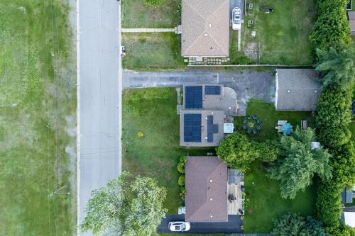 an overhead view of a yard with trees and a road at 3 Bedroom Modern Getaway with Hot Tub and Pet Friendly in Sudbury