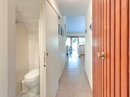 a bathroom with a toilet and a corridor at Holiday Home in Punta Ala by the Sea in Punta Ala