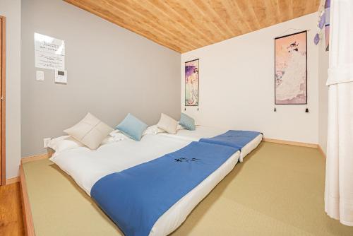 Postel nebo postele na pokoji v ubytování 70-33 駒込駅东口2分 2-4人丨2 minutes from Komagome Station 2-4 people