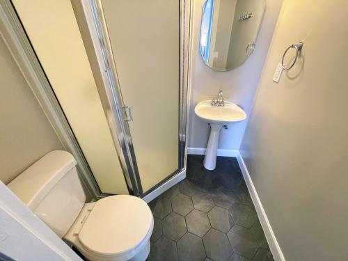 a bathroom with a toilet and a sink at Lake Chelan Manor Room #3 in Chelan