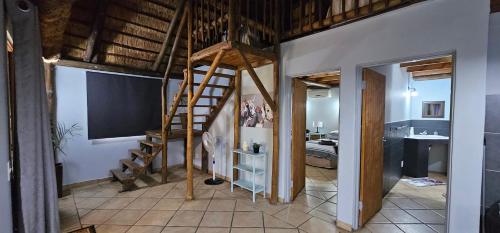 Ένα ή περισσότερα κρεβάτια σε δωμάτιο στο Pongola Tropical