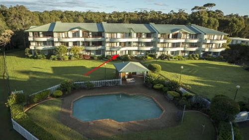 an aerial view of a large apartment building with a pool at Fathoms 2 - 2BR beach resort apartment in Mollymook