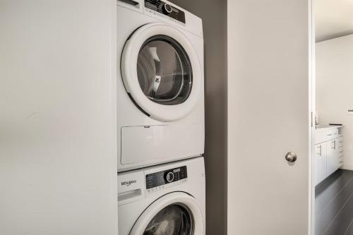 two washing machines stacked on top of each other at Boulevard Stays Comfortable Downtown Highrise STU Pool Parking & Gym 10a in Phoenix