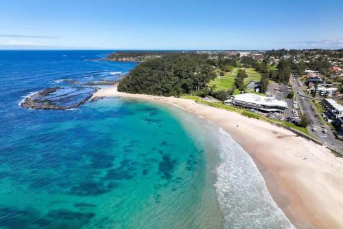 an aerial view of a beach in australia at Ocean Cove - cosy retreat steps from beach & cafes in Mollymook