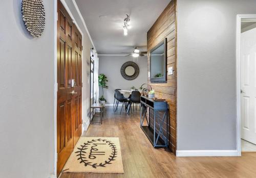 a hallway with a dining room and a dining table at Modern Family Haven Fenced Yrd Grillfirepit in Westminster